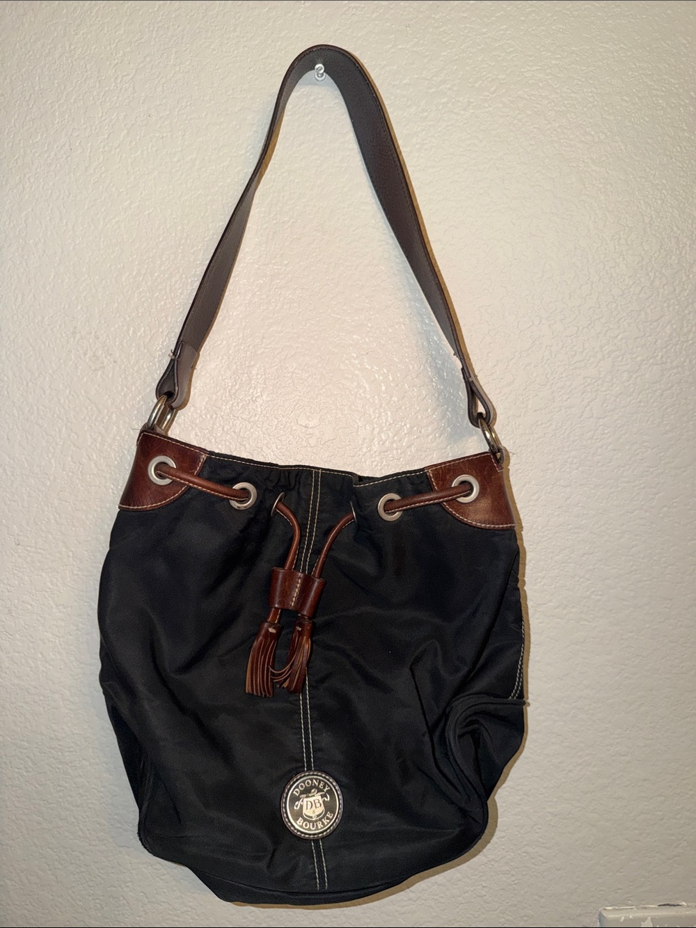 Dooney & Bourke Black Shoulder Drawstring Bag with Brown Trim